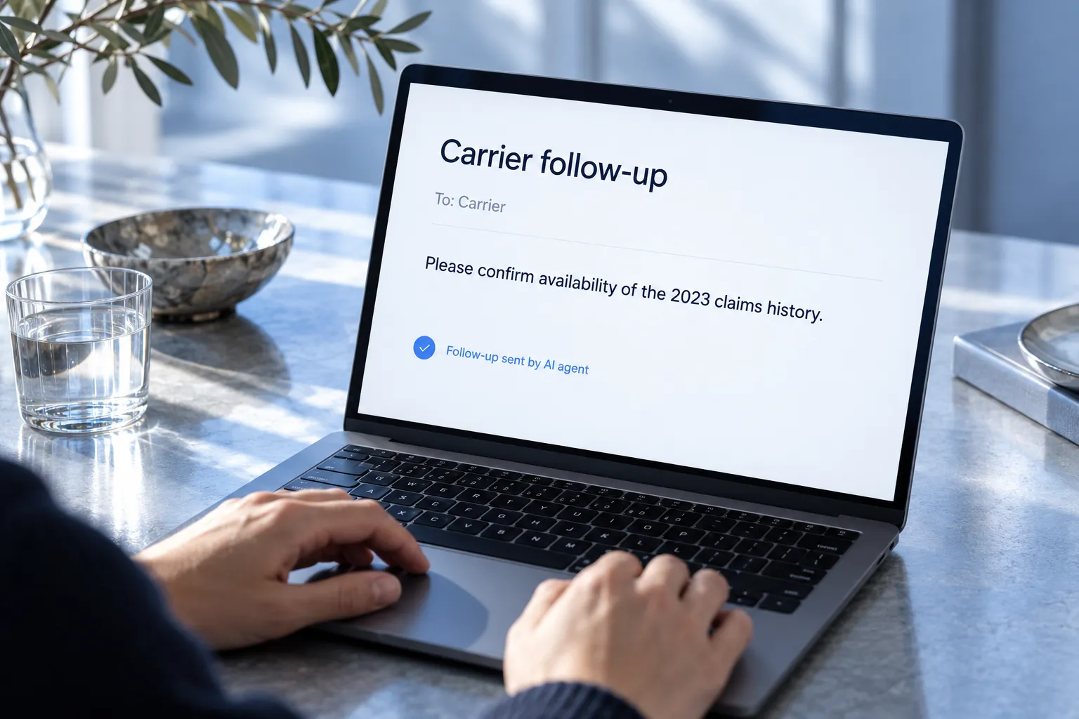 A focused carrier follow-up workflow on a laptop.